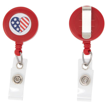 Two red retractable badge holders with heart-shaped designs featuring the American flag. One Patriotic Heart Flag Badge Reel with Belt Clip (P/N 2120-7652) displays the front with the design, while the other shows the back with a metal belt clip. Ideal for those who need a Minimum Quantity order, these badge holders combine style and function perfectly.