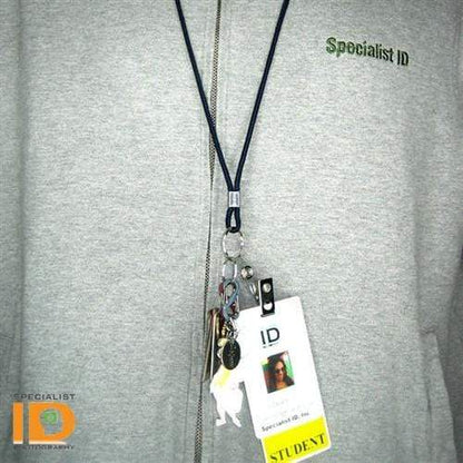 Person wearing a gray jacket with a zip-up front and a Thin Round Lanyard with Keychain Split Ring (2135-310X) holding various keys on a nickel plated steel split ring, as well as an ID card labeled "STUDENT" featuring a photo and the "Specialist ID" logo in the bottom left corner.