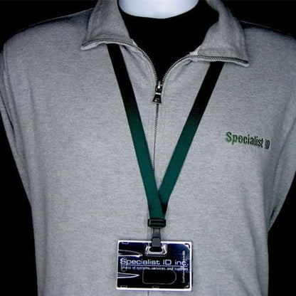 A person wearing a gray zip-up shirt with a green Specialist ID logo and a dark Recycled PET Earth Friendly 3/8" Lanyard, holding a Specialist ID Inc. badge.