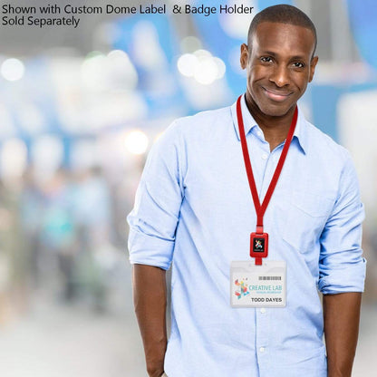 A man wearing a light blue shirt is standing indoors, smiling, and displaying an ID badge around his neck. The ID badge reads "Creative Lab" and "Todd Dayes." Text above mentions the SlimReel Breakaway Lanyard ID Holder Badge Reel Combo (2138-800X) is sold separately.