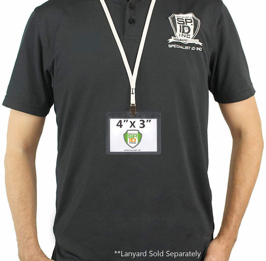 Individual wearing a black polo shirt with an embroidered logo, displaying an ID name tag hanging from a white lanyard. The Economical 4 x 3 Horizontal Badge Holder - Clear Vinyl 4x3 Card Holder with Lanyard Slot & Chain Holes measures 4 inches by 3 inches.