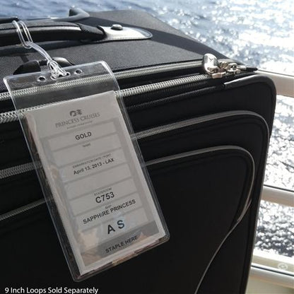 Black suitcase with a 3X6 Vertical Badge Holder Clear Vinyl Credential Sleeve - Also Fits Cruise Luggage Tags (306-357). The tag displays the traveler's Gold status, April 15, 2023 departure from LAX, cabin C753, Sapphire Princess, and boarding group AS. Perfect for secure cruise luggage tags during your voyage.