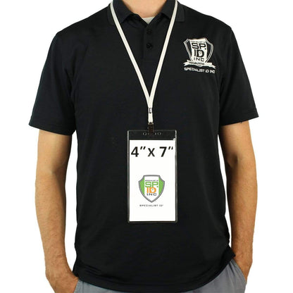 Person wearing a black polo shirt with a company's logo and 4 X 7 Clear Vertical Large Event Badge Holder (306-4258) on a secure, hands-free lanyard, making their 4" x 7" identification badge and credentials highly visible.