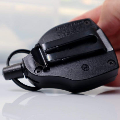 Close-up of a Super Heavy Duty Retractable Keychain - 8oz or 10 Keys - Durable 48” (4 Ft) Kevlar Lanyard being held by a person. The retractable key holder, featuring a durable Kevlar Lanyard, has a hook and several visible screws.