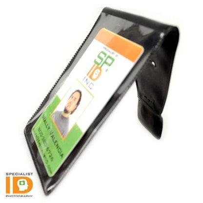 A photo of an Oversize Magnetic Vertical ID Badge Holder for CR100 Cards - 501-L in a clear vinyl holder standing upright. The badge has a photo, green and white background, and text. The logo "Specialist ID" is visible in the bottom left corner.