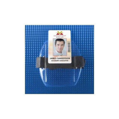 A company identification badge for account executive James Sanderson, secured within a Government ID Size Vertical Arm Band Badge Holder with Heavy Duty Vinyl and Hook & Loop Elastic Band (504-ARFB & 504-ARFW) attached to a blue, textured background with an adjustable elastic strap.