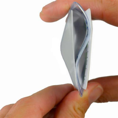 A close-up image of hands pinching a folded, small, translucent object, possibly an adhesive strip or gel pad, reminiscent of the material used in a Two Card Vinyl Badge Holder for Vertical Badges - Premium 2 Pocket Multiple ID Badge Sleeve (506-N2).