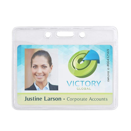 An employee ID badge for Victory Global showing a photo of Justine Larson from Corporate Accounts. The ID number is #66432569, securely enclosed in a Horizontal Premium Clear Vinyl ID Badge Holder (P/N 506-T1).