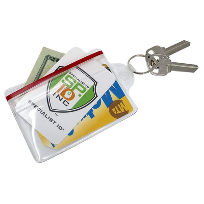 A Clear Soft Horizontal Fuel Card or ID Badge Holder w/ Zipper Closure & Key Ring 506-ZHKR contains a few cards and some cash, attached to a key ring holding two keys.