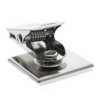 Close-up of a Pressure-Sensitive Adhesive Back Nickel-Plated Clip, 1-Hole Ribbed Face (P/N 5735-2000) attached to a square base, commonly used for holding small items or papers in DIY projects.