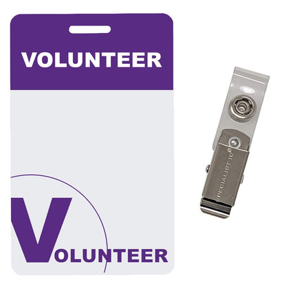 A 5 Pack - Purple Heavy Duty Plastic Volunteer Badges with Clothing Friendly Clip with a purple header and large "V" at the bottom, featuring a clothing friendly clip attachment on a plastic strap. The reusable volunteer labels ensure versatility while maintaining professionalism.
