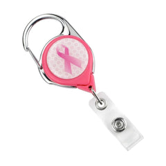 A Custom Printed No Twist Carabiner Badge Reel - Upload Your Logo with a silver clip at the top and a pink ribbon emblem in the center, perfect for custom badge reels or personalized logo badges.