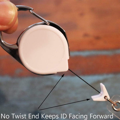 A hand holds a Carabiner No Twist Badge Reel (P/N 704-CB) featuring a retractable cord with a no twist design. Text on the image reads, "No Twist End Keeps ID Facing Forward. Sold by Specialist ID.