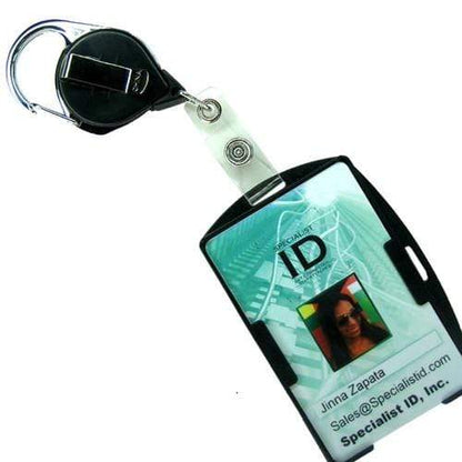 An ID badge for Specialist ID, Inc. featuring a No Twist Badge Reel with Carabiner And Belt Clip (704-CLP) with a retractable holder. The badge displays the name Jinna Zapata and contact information for Sales at Specialist ID, Inc.