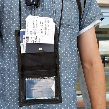 Person wearing a blue patterned shirt with a black Multi-Pocket Credential Neck Wallet with Lanyard (1860-300X) containing tickets, an identification card, and a multi-pocket wallet.