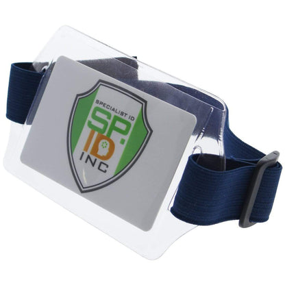 A Horizontal Arm ID Badge Holders (ABH-H) with a Specialist ID Inc card inside, attached to a blue adjustable hook and loop armband.