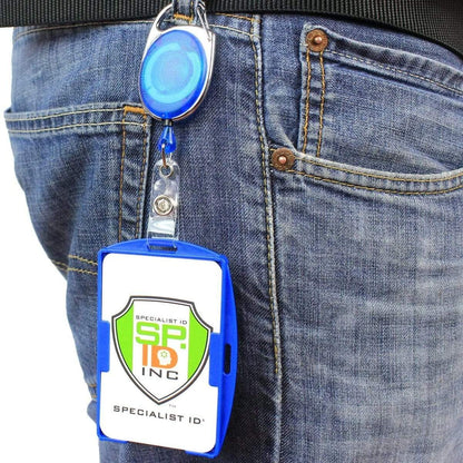Person wearing blue jeans with a Two Card Holder - Rigid Open-Faced (P/N AH-150) attached to their belt, displaying a Specialist ID Inc. card.