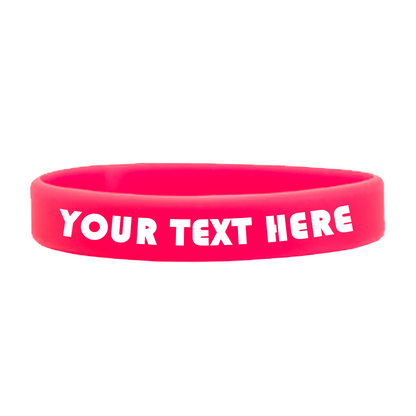 A high-quality red Customizable Adult 1/2" Silicone Wristband featuring the text "YOUR TEXT HERE" in white block letters, perfect for promoting a cause. Customizable silicone wristbands allow you to personalize your message and make a statement effortlessly.