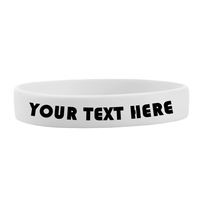 White customizable 1/2" silicone wristband with bold black text that reads "YOUR TEXT HERE." The high-quality Customizable Adult 1/2" Silicone Wristbands are plain with no other design elements, perfect for promoting a cause.