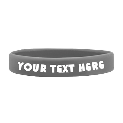 Gray Customizable Adult 1/2" Silicone Wristbands made of high-quality silicone with the words "YOUR TEXT HERE" written in bold, white letters, perfect for promoting a cause. Sold by Specialist ID.
