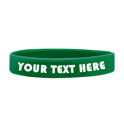 Green wristband with "YOUR TEXT HERE" written in white, bold letters, made from high-quality silicone. Customizable Adult 1/2" Silicone Wristbands are perfect for promoting a cause.