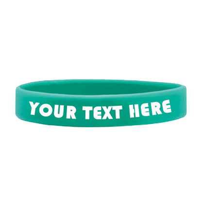 A high-quality teal Customizable Adult 1/2" Silicone Wristband with the text "YOUR TEXT HERE" printed in white, perfect for promoting a cause. Customizable silicone wristbands like this one ensure your message stands out.