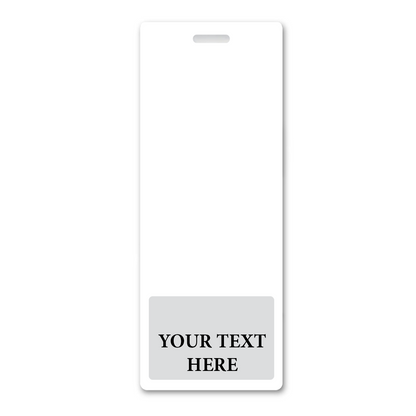 A white name badge with a rectangular shape and a small slot at the top for a lanyard. The bottom section features a gray area with the placeholder text "YOUR TEXT HERE." Perfect for Oversized Custom Vertical Badge Buddy XL- (Extra Large Size) to suit any professional setting.
