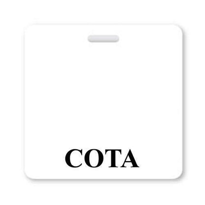 A square white badge with the word "COTA" Horizontal Badge Buddy with White Border printed in black at the bottom center, perfect for role recognition in a hospital environment. Sold by Specialist ID.