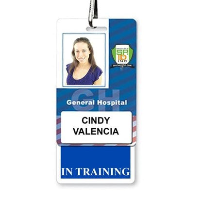 A laminated teslin badge for Cindy Valencia at General Hospital proudly displays her photo and the designation "IN TRAINING." For added convenience, an "IN TRAINING" Vertical Badge Buddy with Blue border is included to ensure clear recognition of her status.