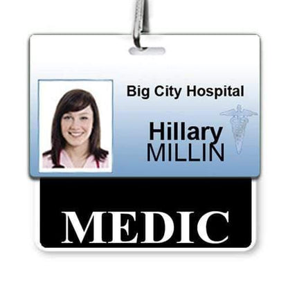 Identification badge with a photo of a smiling woman, labeled "Hillary Millin" from "Big City Hospital," featuring a MEDIC Horizontal Badge Buddy with BLACK Border at the bottom for instant role recognition.