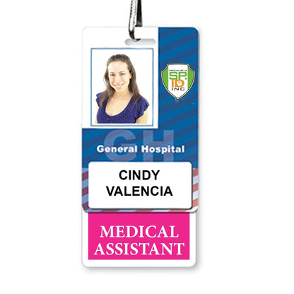 A hospital ID badge displaying the photo, name "Cindy Valencia," and title "Medical Assistant" with the General Hospital logo. The MEDICAL ASSISTANT Vertical Badge Buddy with Hot Pink Border features a hot pink border for added visibility.
