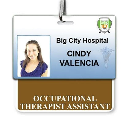 ID badge for Big City Hospital with the name "Cindy Valencia" and title "Occupational Therapist Assistant." The badge, designed for a hospital environment, includes a photo of a woman, the hospital logo, and a caduceus symbol. This might also serve as an essential Occupational Therapist Assistant Horizontal Badge Buddy with Brown Border for quick identification.