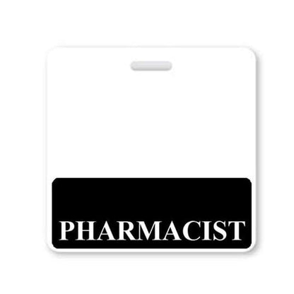 A laminated teslin badge displays the word "PHARMACIST" in white capital letters on a black background at the bottom. The upper part of the badge is blank and white, ideal for roll recognition or attaching to a "Pharmacist" Horizontal Badge Buddy with Black Border.