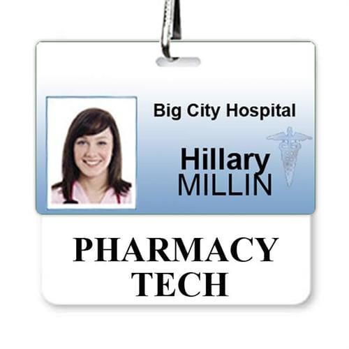 ID badge for Big City Hospital with a photo of a woman and the name "Hillary Millin," identifying her as a pharmacy tech. The ID card holder prominently showcases her designation with an optional White PHARMACY TECH Horizontal Badge Buddy for easy identification.