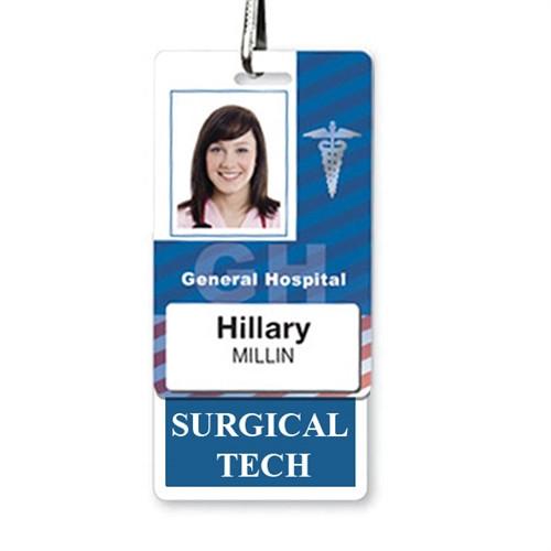 ID badge for General Hospital showing a laminated teslin photo of a person with the name "Hillary Millin" and the job title "Surgical Tech," providing seamless, instant roll recognition using a "SURGICAL TECH" Vertical Badge Buddy with Blue border.