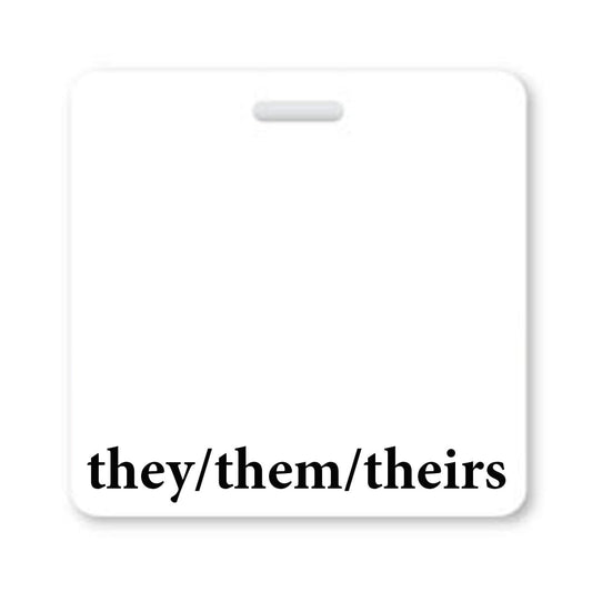 A Pronouns Badge Buddy They/Them/Theirs Gender Neutral - Horizontal with White Border, with a hole at the top for attachment, displaying the gender neutral pronouns "they/them/theirs" in black text at the bottom, promoting diversity inclusion among badge buddies.