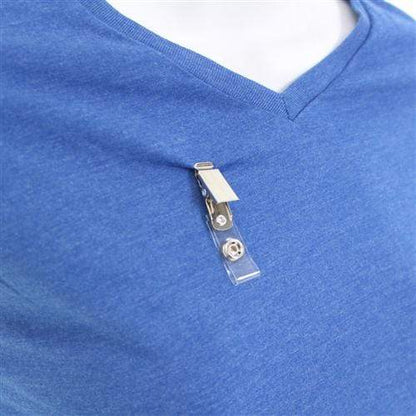 Close-up of a person wearing a blue V-neck shirt with Clothing Friendly ID Badge Clips with Smooth Bulldog Clip and Vinyl Strap attached to the fabric. Sold by Specialist ID.