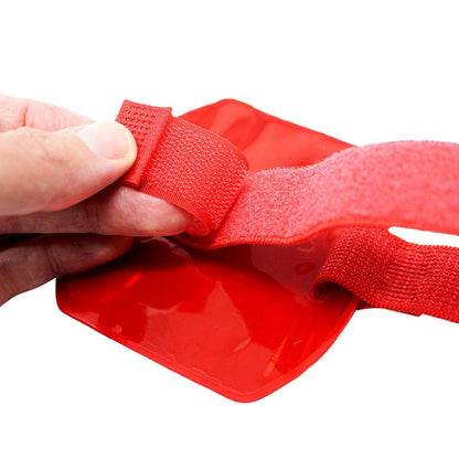Close-up of a hand adjusting the Velcro strap on a Vertical Reflective Armband ID Holder (R504-ARN).
