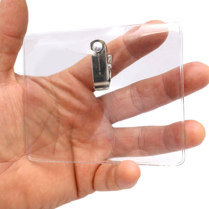 A hand holding a 4 x 3 Horizontal Event Badge Holder with Clothing Friendly Bulldog Clip - Clear Vinyl, Horizontal & Durable (SPID-1440).
