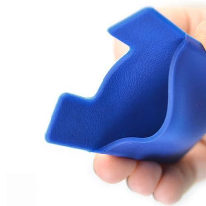 Flexible blue silicone phone wallet shown by hand