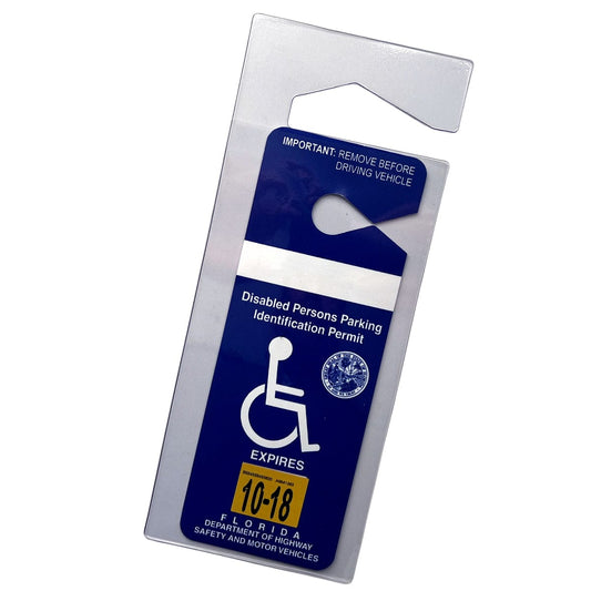A Specialist ID Handicap Hang Tag Holder (SPID-1120) with a blue and white disabled persons parking identification permit tag from Florida's Department of Highway Safety and Motor Vehicles, designed to fit in a clear vinyl handicap holder, with an expiration date sticker from October 2018.