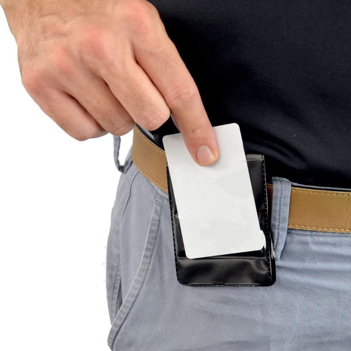 A person inserts a white card into a Magnetic Vertical Double Pocket Badge Holder (1835-1115) attached to their belt.