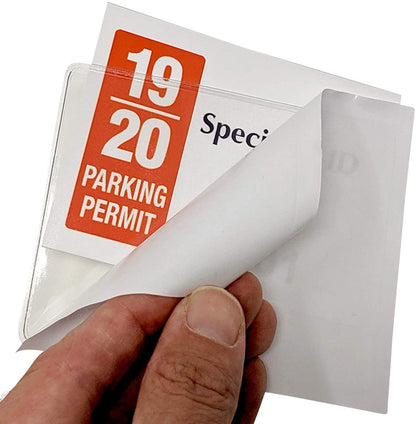 A hand holds a parking permit labeled "19/20" while peeling back the transparent protective cover of a Large 4 x 3 Adhesive Badge Holders with Sticky Back - Clear Vinyl Parking Pass Holders for Windshield (CE-4P).