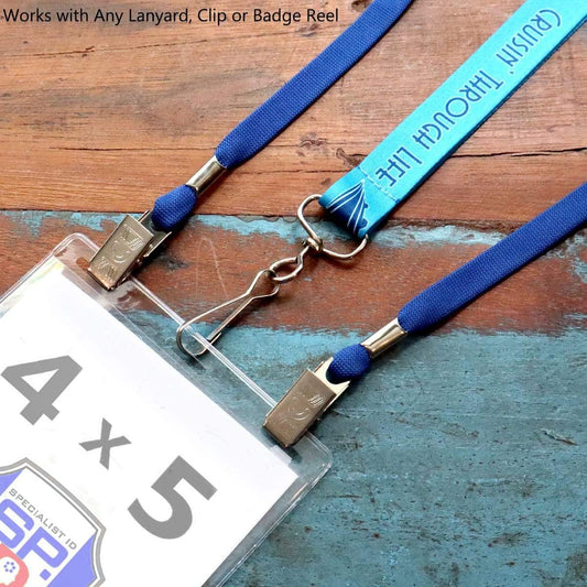 Close-up of two blue lanyards with metallic clips and a clear oversize badge holder displaying a 4 x 5 card. Text above reads "Works with Any Lanyard, Clip or Badge Reel. Product Name: 4x5 Badge Holder - USA Made - Large, Plastic 4 x 5 Card Sleeve for Event Tickets & Passes (SPID-1600)
