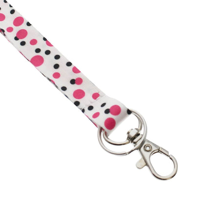 A **Cute Polka Dot Pattern Fashion Lanyard With Lobster Hook And Key Ring(P/N 2138-728X)** features a metal clasp, key ring, and trigger snap hook at the end. It also includes a safety breakaway feature for added security.