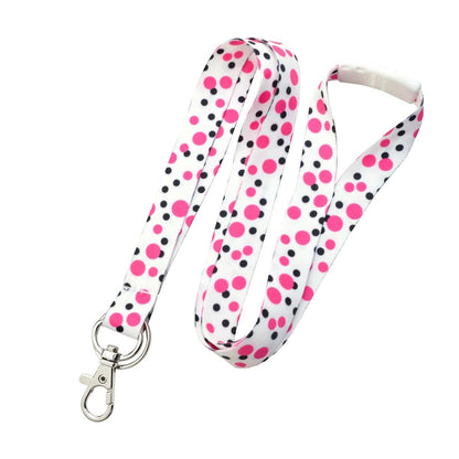 A Cute Polka Dot Pattern Fashion Lanyard With Lobster Hook And Key Ring(P/N 2138-728X) with a white background featuring a pattern of pink and black polka dots, equipped with a metal clasp and key ring at the end.