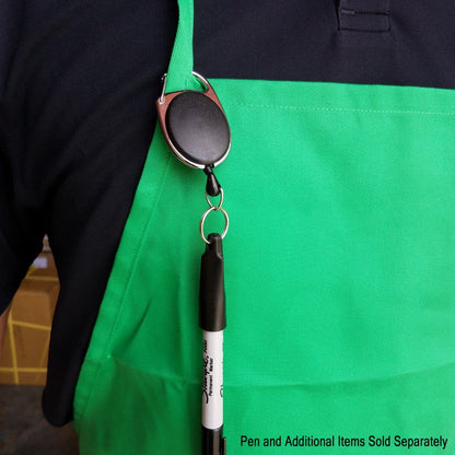 Close-up of a person wearing a green apron with a pen holder and Retractable Pull Badge Reel Pen / Pencil Holder with Carabiner Clip SPID-3280 attached to the chest, holding a pen. Text on the image reads "Pen and Additional Items Sold Separately".