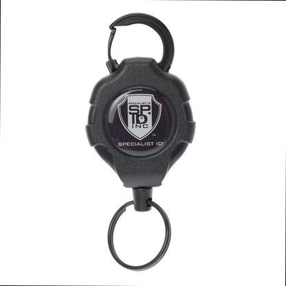A heavy-duty key reel with a Kevlar cord, this black Heavy Duty Retractable Ratchit Keychain Tether Reel for Multiple Keys with Clip and Locking Feature also includes a key ring and carabiner clip, featuring the Specialist ID logo.
