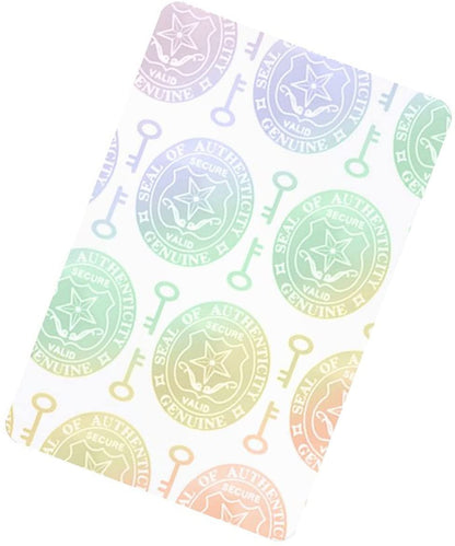 A rectangular sticker sheet with a Self Adhesive Holographic Overlay - Shield and Key displaying repeating seals labeled "Seal of Authenticity" alongside key icons, offering robust anti-counterfeiting protection.