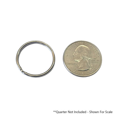 A small, heat-treated steel key ring next to a US quarter used for size reference. The text reads, "Quarter Not Included - Shown For Scale. 100 Round Split Ring Key Chains - 1" Inch Size - Heavy Duty Premium Key Rings in Bulk (SPID-9230)